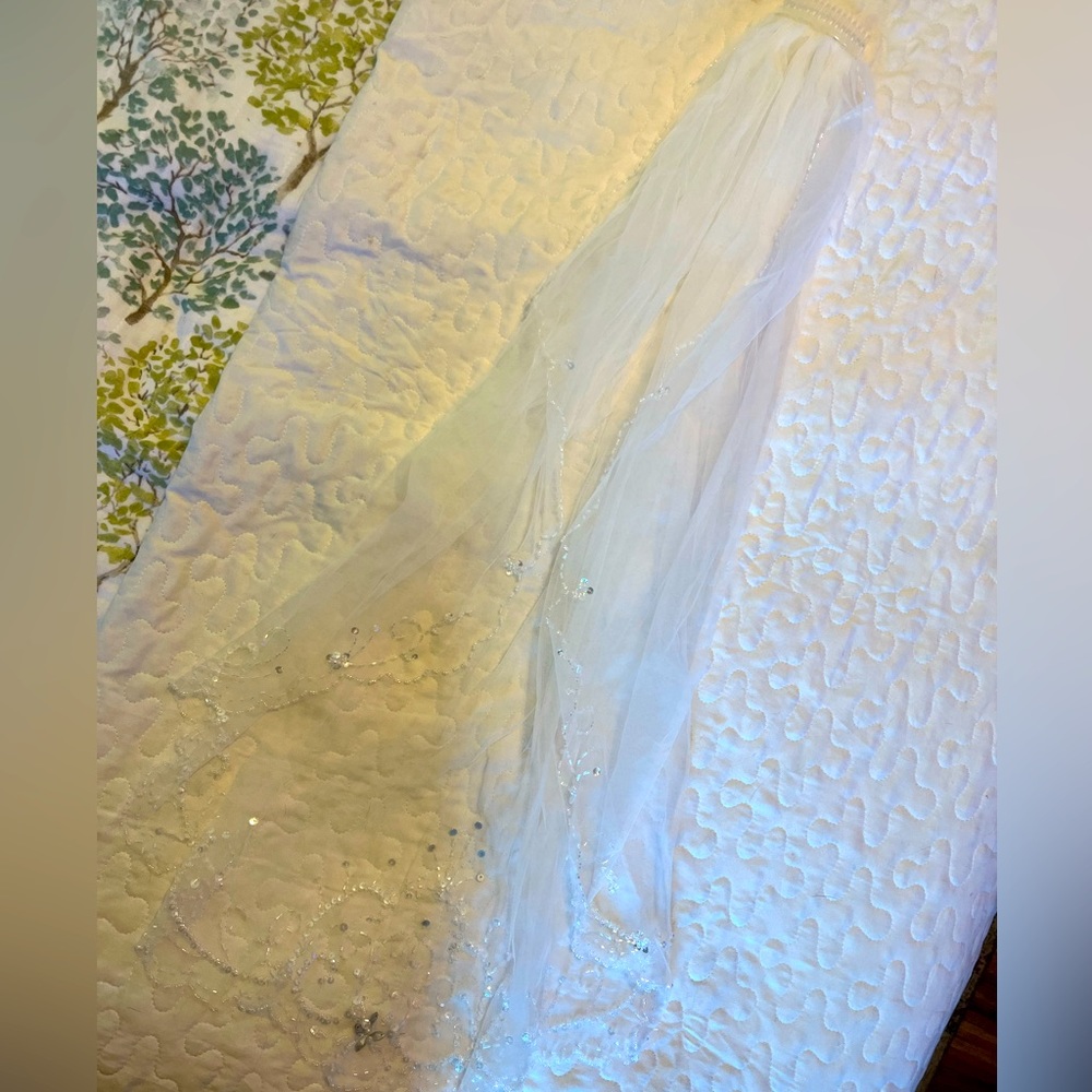 Tulle wedding veil with beautiful beading. Plastic comb.